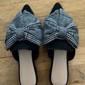 Something Navy black mules with houndstooth bow